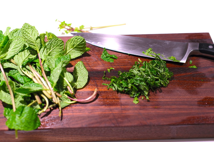 Image of Pluck mint leaves and thinly chop them (discard stems) and add to a small bowl