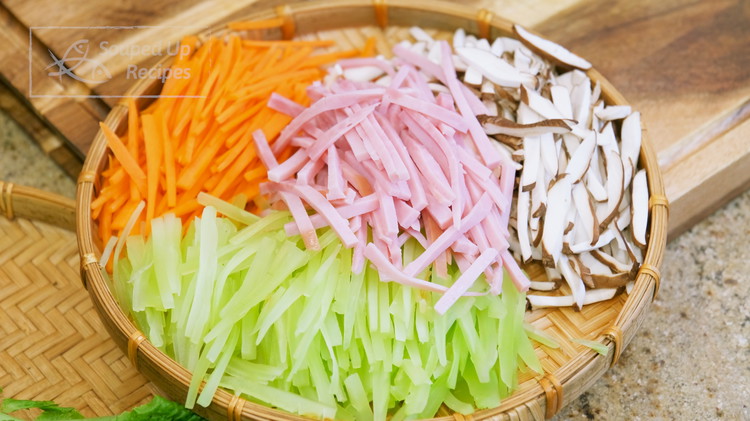 Image of During this time, prepare the vegetables. Thinly julienne 3 oz shiitake mushroom, 3 oz, 12 oz stem lettuce, and 3 oz ham and set them aside. In China, we normally use lunch meat for this recipe, but I found that...