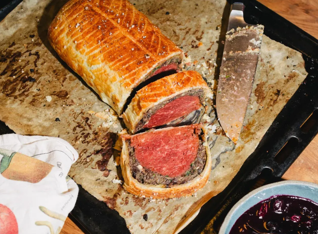Golden Vegan Wellington with vibrant blueberry-red wine chutney
