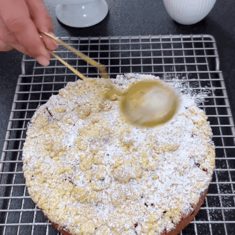 Image of Finish by dusting the cooled cake with powdered sugar.