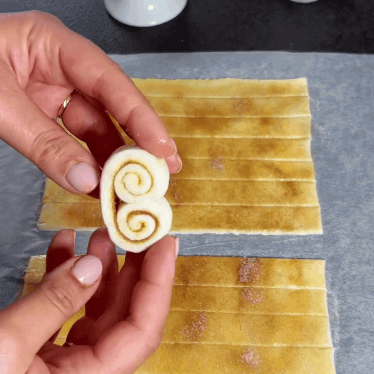 Image of Roll up one strip towards the center and roll up from the other side as well.