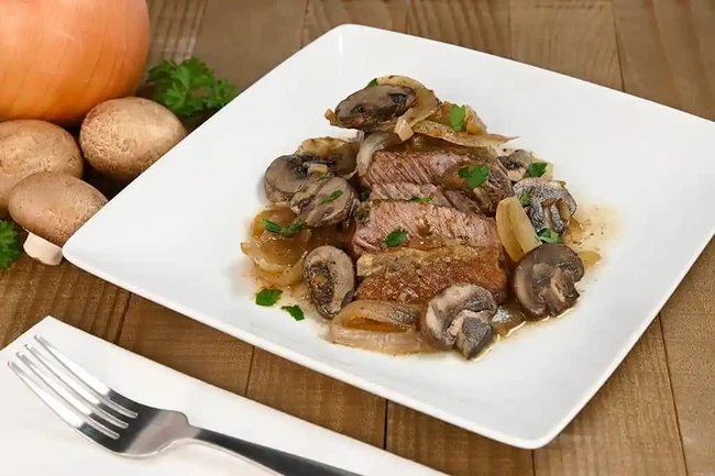 round tip steak smothered in mushrooms and onions