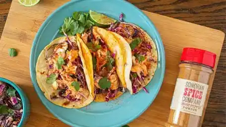 Image of Remove from stove and topped with fish, slaw, chipotle dressing, and more coriander and lime of desired.