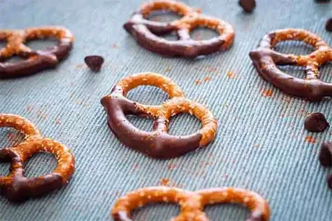 Image of Set chocolate-covered pretzels to the side to sit for 30...