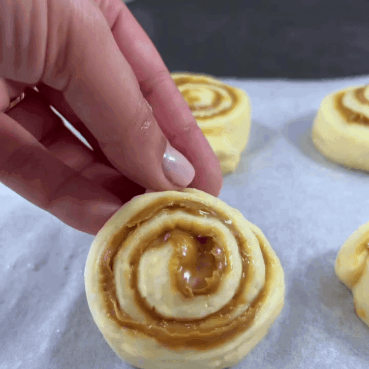 Image of Roll up the strips and place them on a baking sheet.