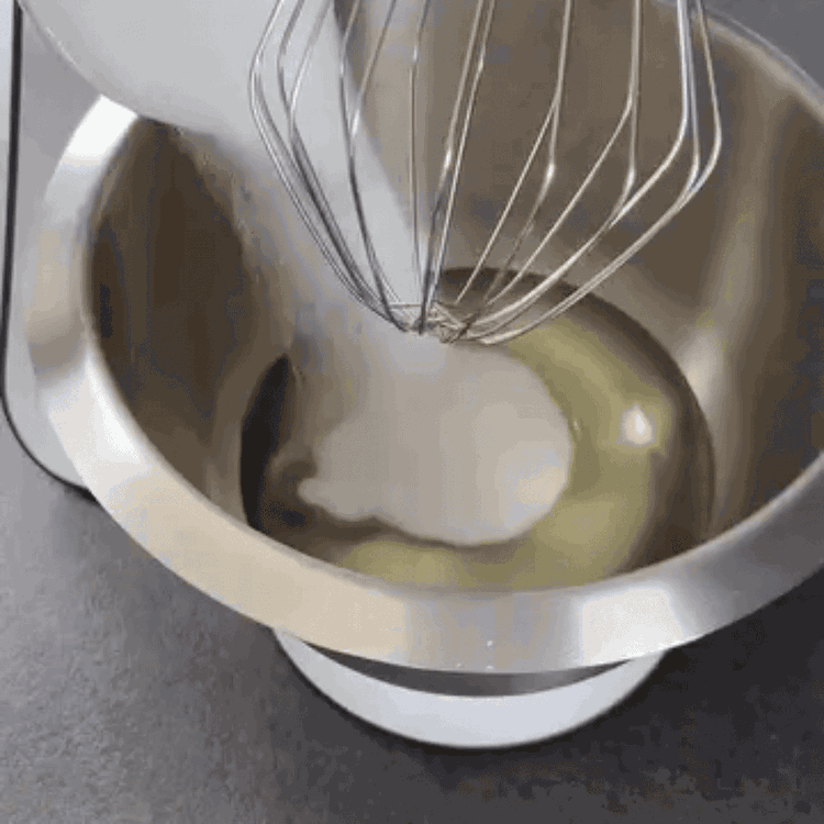 Image of In a large bowl, mix the sunflower oil with sugar,...