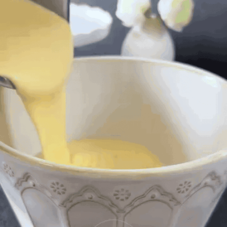 Image of In a separate bowl, combine the flour, baking powder, and...