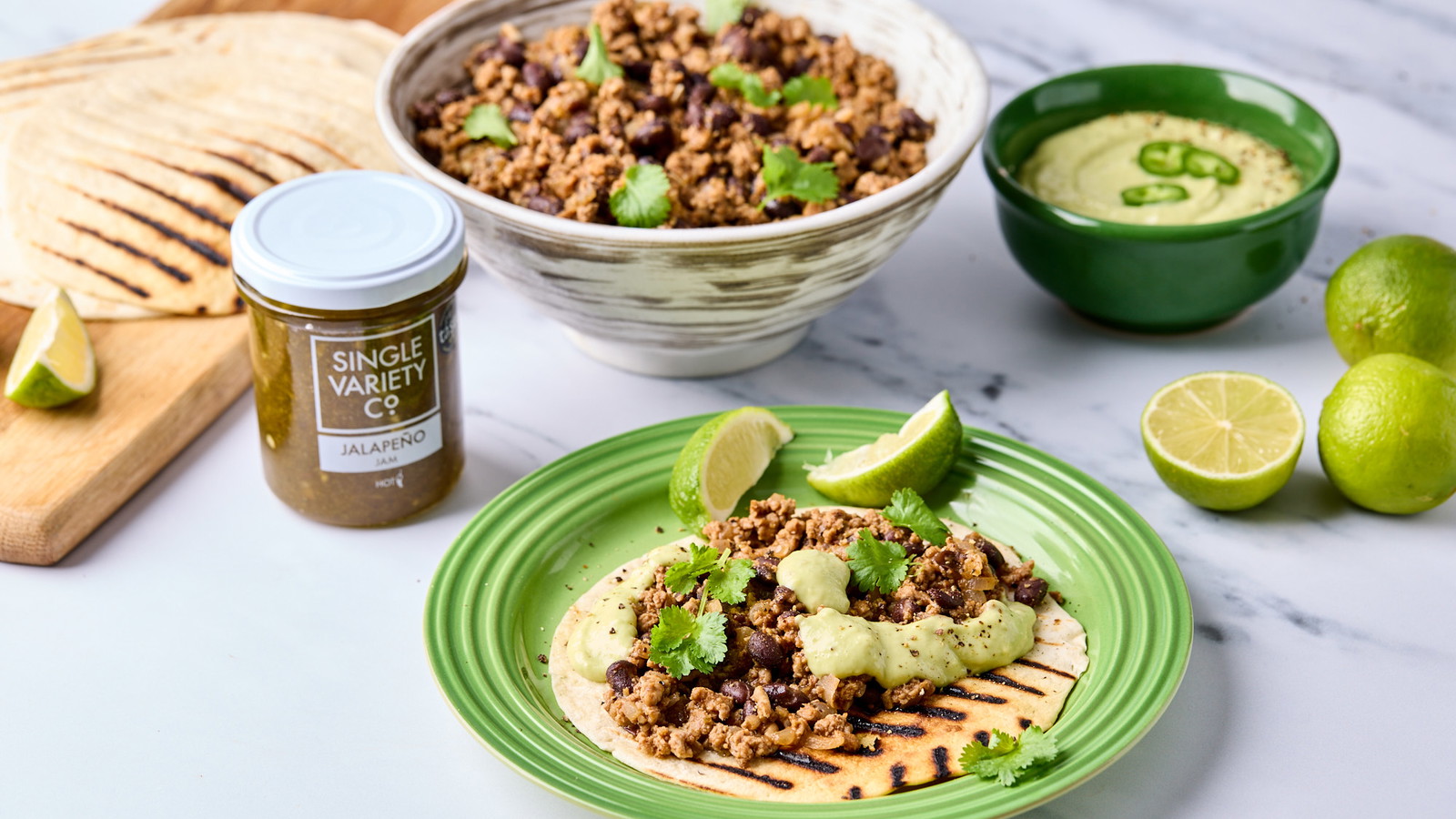 Image of Turkey Mince Tostadas with Avocado & Jalapeño Sauce 