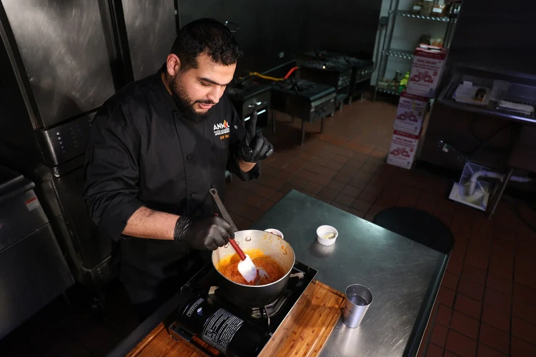 Image of Cook on medium-low heat for 15-20 minutes, stirring occasionally. Pro Tip: The darker the tomato color, the richer the flavor—but don’t let it dry out! If needed, add a splash of water.