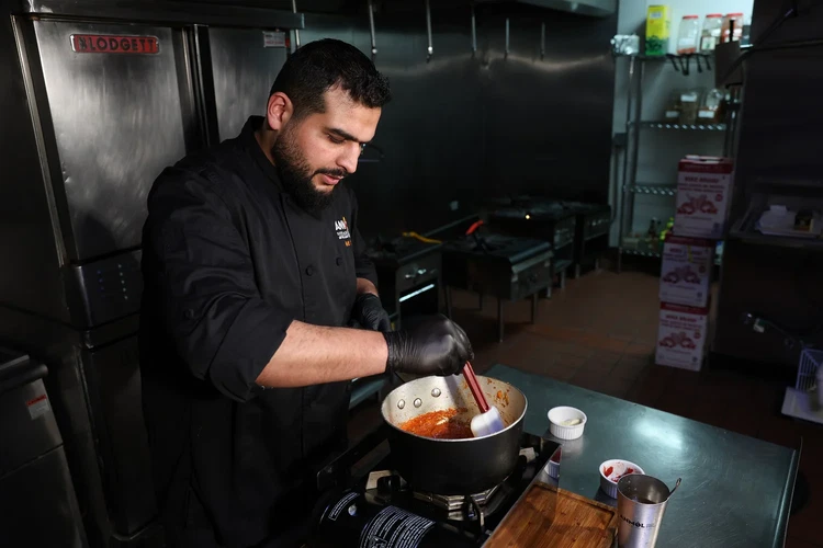 Image of Stir in tomato paste and whisk until the sauce reaches a smooth, consistent color.