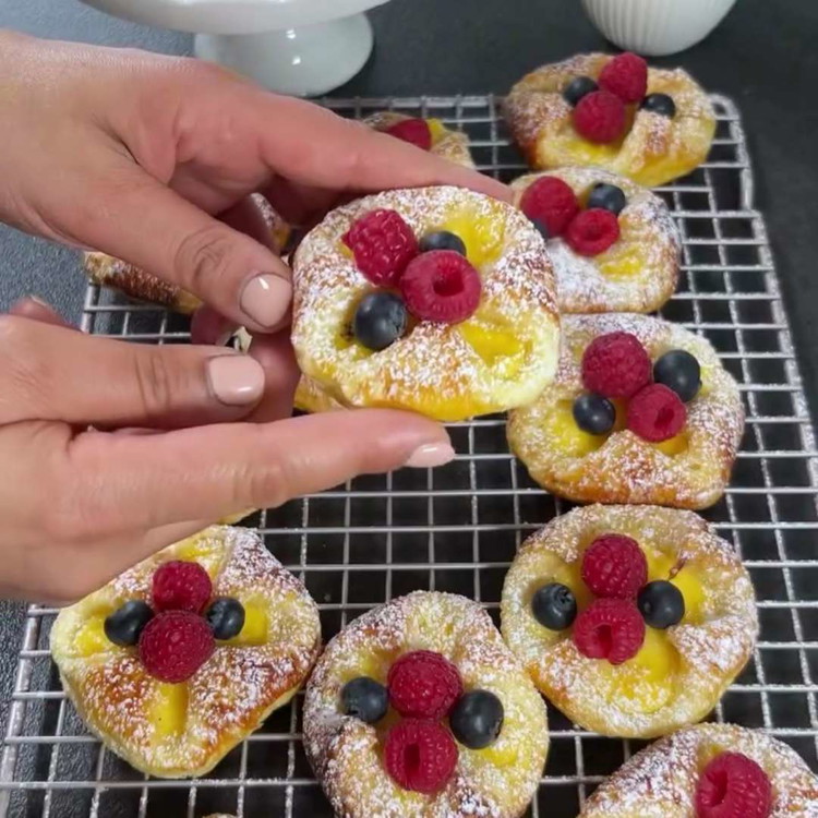 Image of Place the pudding pockets on the prepared baking sheet and bake in the preheated oven for about 15-20 minutes, or until golden brown and crispy.