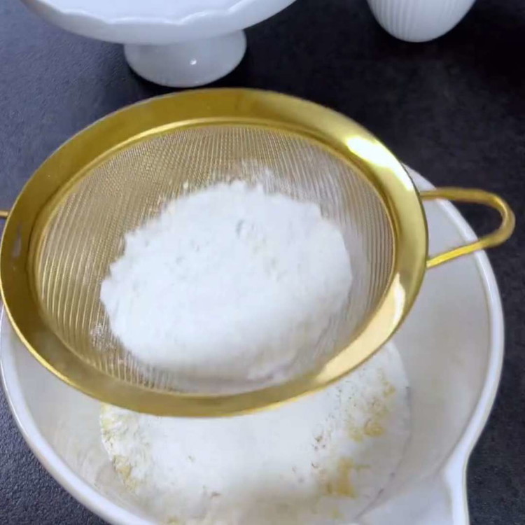 Image of In a bowl, combine powdered sugar, almond flour, all-purpose flour, and a pinch of salt.