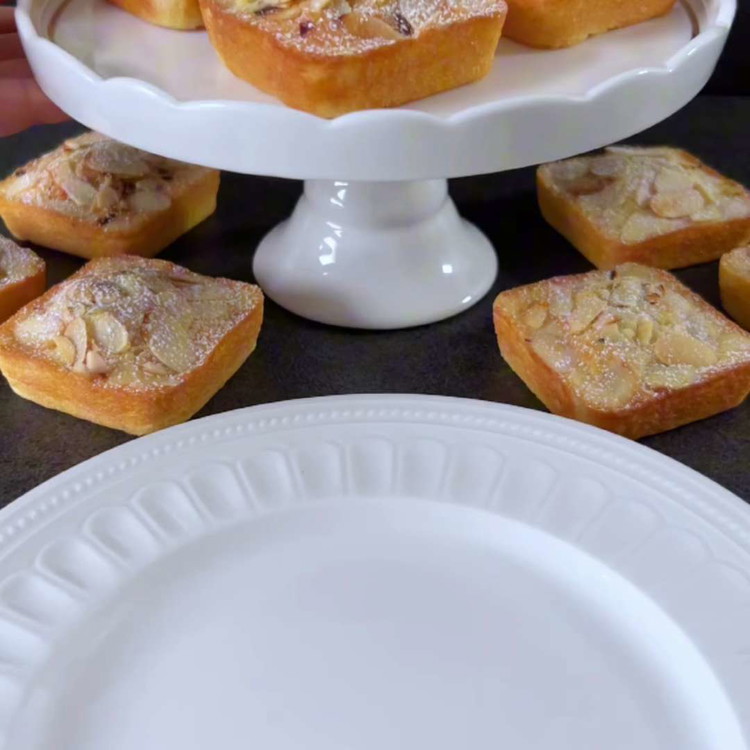 Image of Allow them to cool slightly in the molds before transferring them to a wire rack. Lightly dust with powdered sugar.