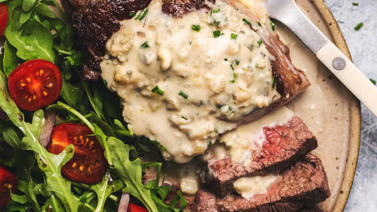 Image of New York Steak with Blue Cheese Sauce & Arugula Salad