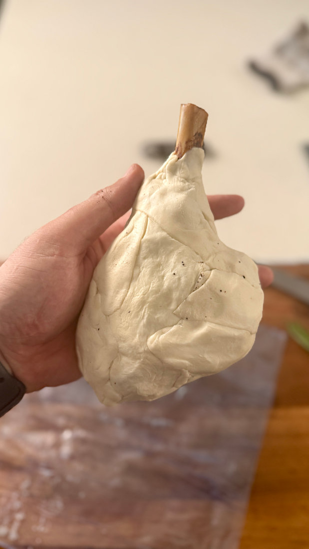 Image of Once the shanks have cooled to below 50C internal, wrap in puff pastry and bang them into a preheated oven at 180C on a tray with baking paper.