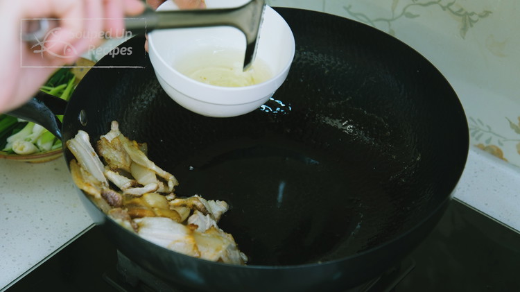 Image of Heat the wok over medium heat and add the pork slices. Stir for 3 minutes or until a few tablespoons of fat is rendered from the pork. You can take some pork fat out of the wok so the dish...