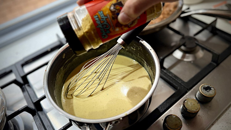 Image of then add your milk 50 odd ml at a time and slowly whisk it together. right at the end add your small handful of cheese, whisk until melted through and add salt as required. Chicken & Chips rub works well...