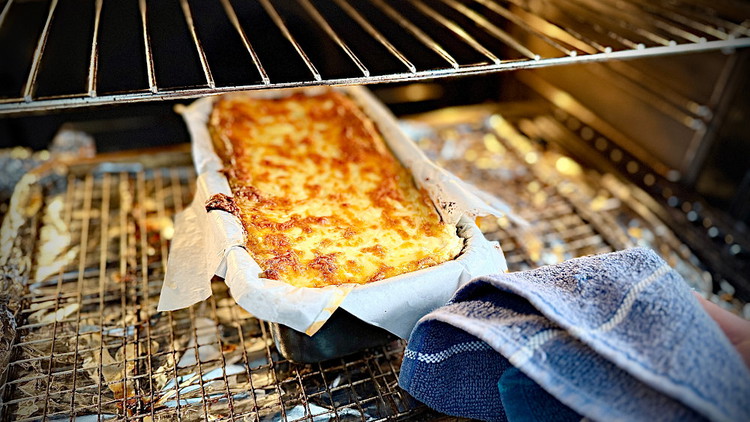 Image of Pre-heat the oven to 180C/350F and bake for approximately one hour until the cheese is bubbly and golden on top. 