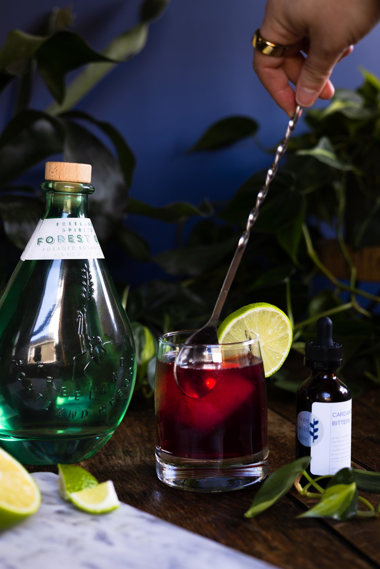 Image of Fill a lowball glass with one large ice cube. Pour everything but the soda water over ice, stir for a few seconds, then top with soda water and garnish with the lime. Cheers!Notes & variations:❁ A dropperful refers to the...