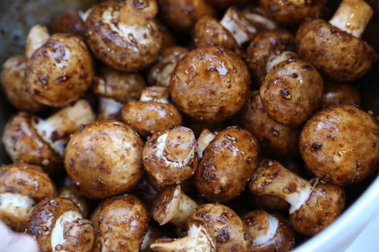 Image of Add everything but the mushrooms to a bowl and stir to combine and then toss the mushrooms in the sauce.