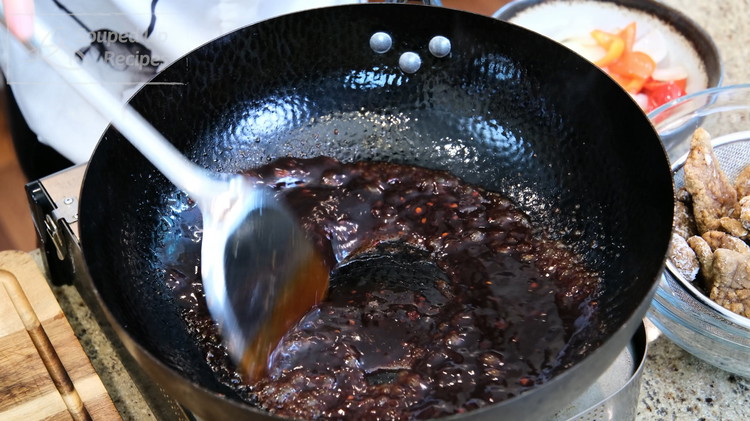 Image of Pour in the Beijing beef sauce. Stir over medium heat for a couple of minutes or until it is thickened.