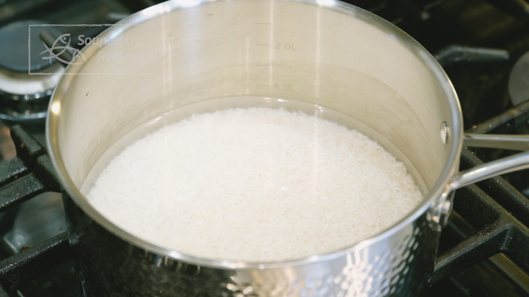 Image of Rinse the jasmine rice with water and drain thoroughly. Add the rice to a pot along with 2 cups of water. Turn the heat to high and bring the pot to a simmer. This will take just a few minutes....