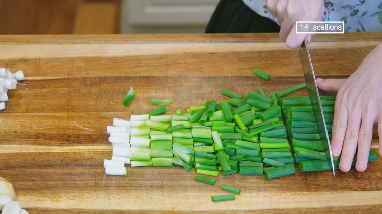 Image of While waiting, discard the scallion roots and dice the scallions into 1/2-inch long pieces. If you don'tdon't like scallions, you can totally replace them with cilantro or basil instead.