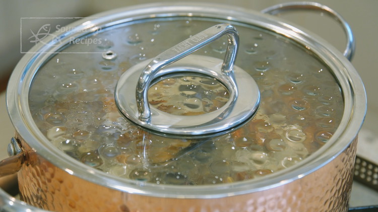 Image of Place the pot onto the stove and turn the heat to high. Bring it to a boil. Put on the lid and switch the heat to the lowest. Continue to cook for 16 more minutes.