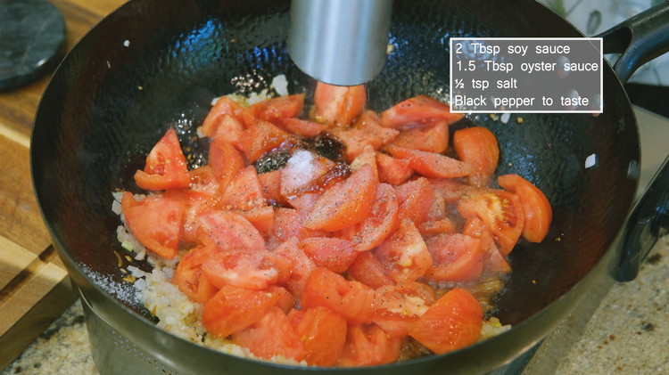 Image of Add the garlic, tomato, 2 Tbsp soy sauce, 1.5 Tbsp oyster sauce, 1/2 tsp of salt, and black pepper and keep stirring for 3 minutes or until the tomatoes are slightly soft. I like to smash the tomatoes with the...