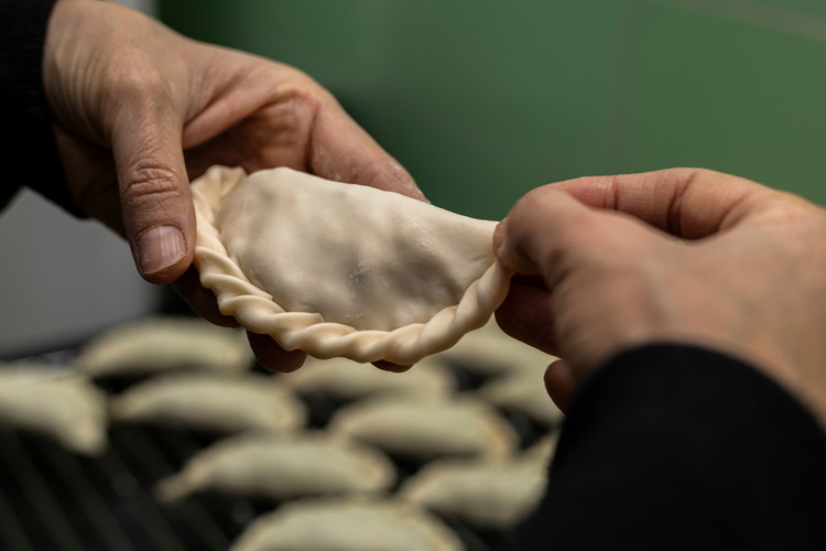Image of Place a spoonful of the beef mixture on one half of each pastry circle, fold over, and crimp the edges to seal.