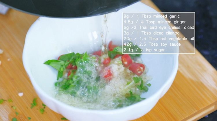 Image of Heat the vegetable oil in a small saucepan until smoking hot and pour it onto the aromatics to activate the fragrance. Add the soy sauce and sugar. Stir thoroughly.
