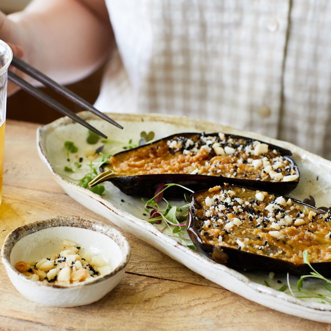 a popular Japanese dish with a macadamia twist. Grilled eggplant, crushed macadamia and miso dressing