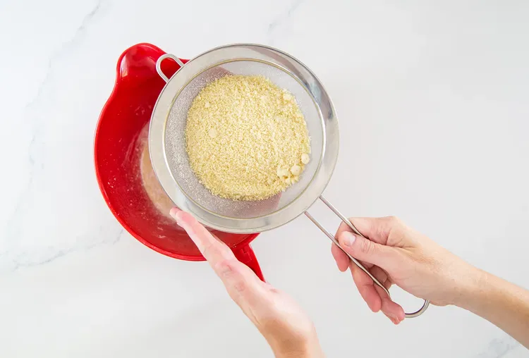 Image of Pulse almond flour and confectioner's sugar in a food processor...