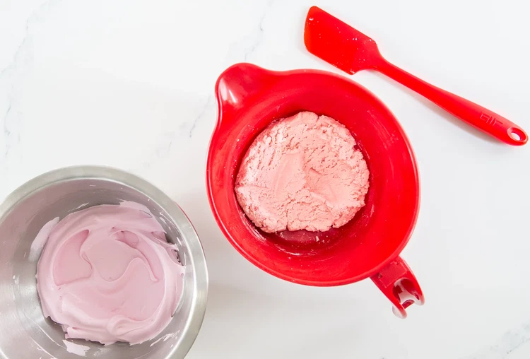 Image of Fold a third of the meringue into the dry mixture with a spatula. Add the remaining meringue in two more portions. Batter should flow like thick honey and form a figure 8 without breaking. Stop folding once you reach this...