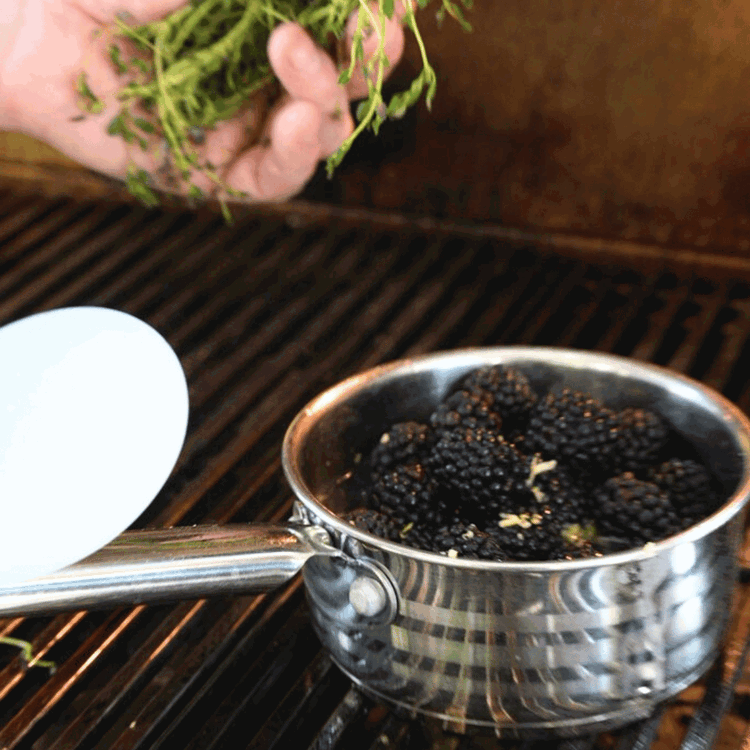 Image of Simmer the berries for 20–30 minutes until thickened. Remove the thyme to serve.