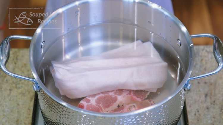 Image of Add the pork skin and bones to a big stock pot, fill it with water, and then bring it to a boil. Souped Up Swap: If you don’t eat pork, replace the pork skin with 227g / 0.5 pound chicken...