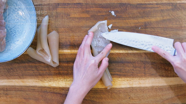 Image of Use a chef's knife to scrub any attached fat from...