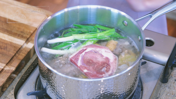 Image of Fill another pot with 5 cups water and add the pork skin strips, bones, ginger slices, scallions, and Jinhua ham and bring to a boil.