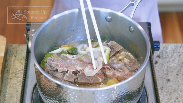 Image of Simmer the soup over the lowest heat for 3 hours or until the broth becomes milky and creamy.