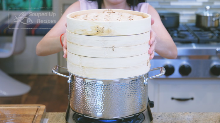 Image of Pre-boil a pot of water and place the steamer above it. Steam the xiao long bao over high heat for 15 minutes.