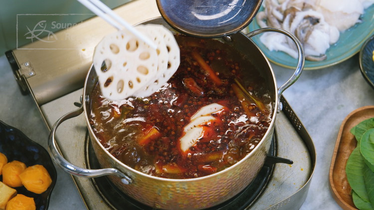 Image of Cook all the hot pot items in the spicy Lao Gan Ma stock and enjoy them with the dipping sauce.