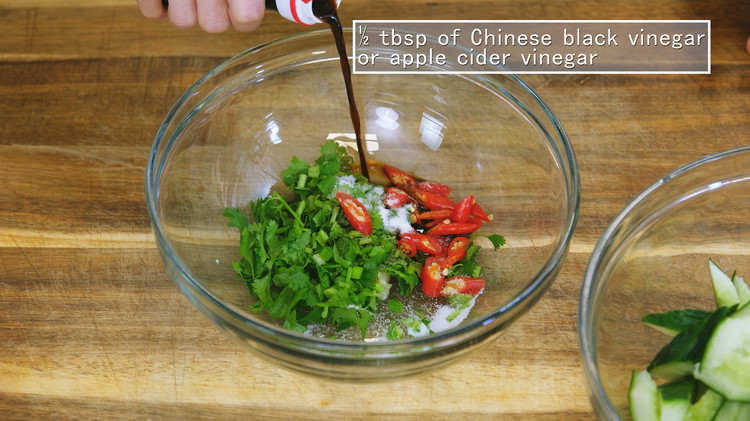 Image of Combine the grated garlic (3 cloves), 1/4 cup of diced cilantro, 1 tbsp of diced Thai bird eye chilies, 1/2 tsp of sugar, 1/2 tbsp of soy sauce, and 1/2 tbsp of vinegar in a bowl. For authenticity, I recommend using...