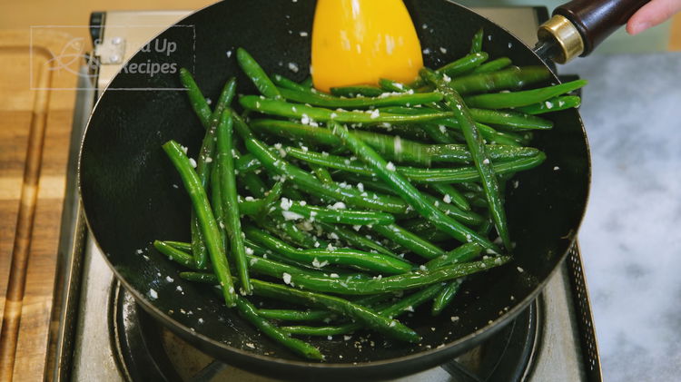 Image of Push the green beans to the side of the wok...
