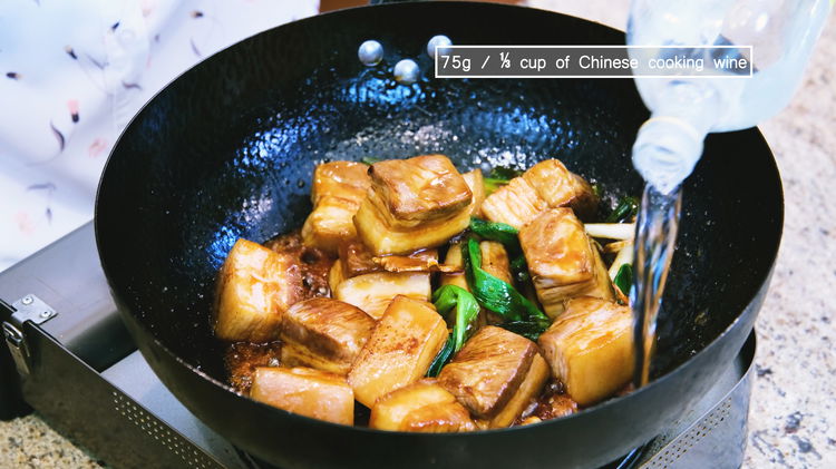 Image of Add the pork belly back into the wok. Pour the...