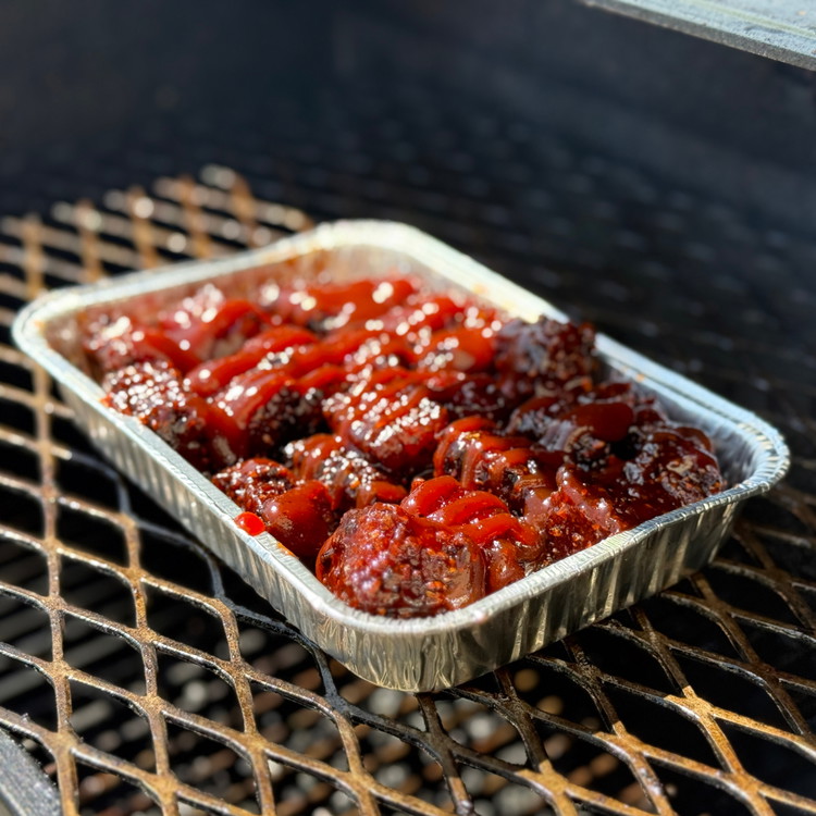 Image of Return to the smoker or oven for another 20–30 minutes, uncovered, to let the sauce caramelize and get sticky.