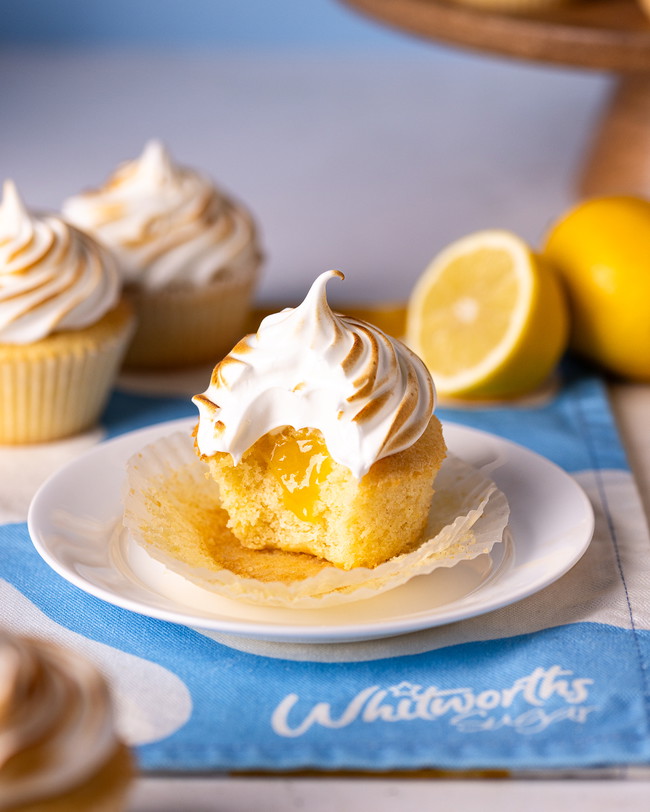 Lemon meringue cupcakes filled with lemon curd and topped with meringue and lightly toasted