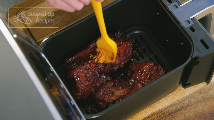 Image of After 18 minutes, brush the extra sauce left in the...