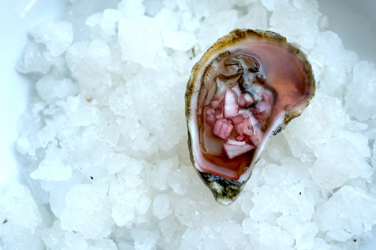Image of Spoon a small amount of liquid and shallots over freshly shucked oysters.  Slurp and enjoy