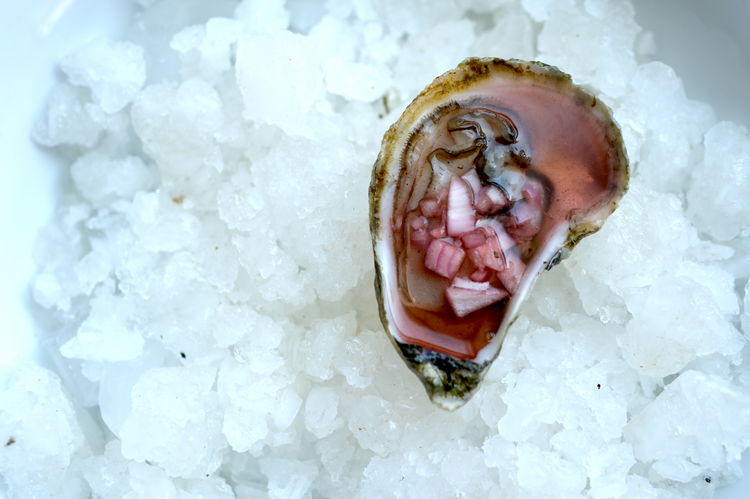 Image of Spoon a small amount of liquid and shallots over freshly...