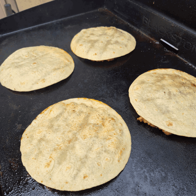 Image of Place each meatball onto the hot skillet, cover it with a tortilla and then smash it flat with a heavy spatula, or griddle press (a plate or small pan works too) Cook for 1.5-2 minutes until a crust forms, and...